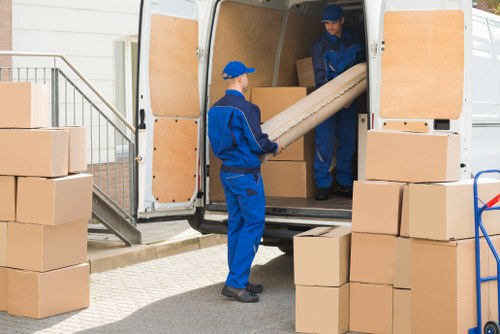 Man and van loading furniture for a local move in Surrey