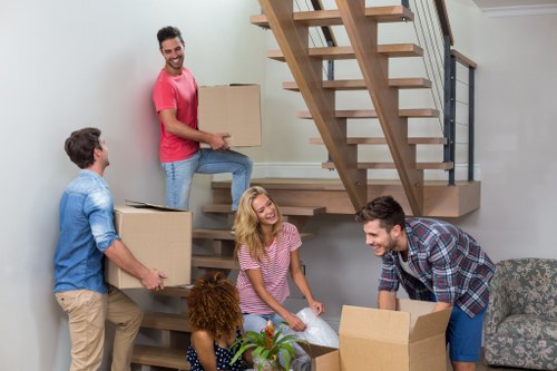 Removal team supporting a Surrey home move with boxes and furniture