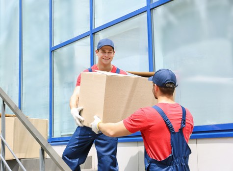 Removal van and boxes outside a Surrey home during a house move