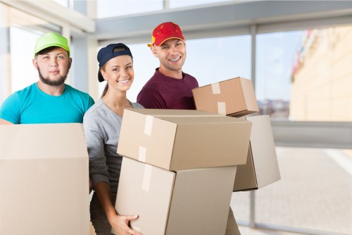 Professional movers handling furniture during a house move in Surrey