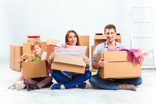 Professional movers handling furniture in a Surrey property