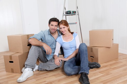 Professional Surrey man and van team handling furniture carefully