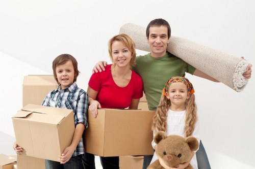 Professional movers handling household items in Surrey