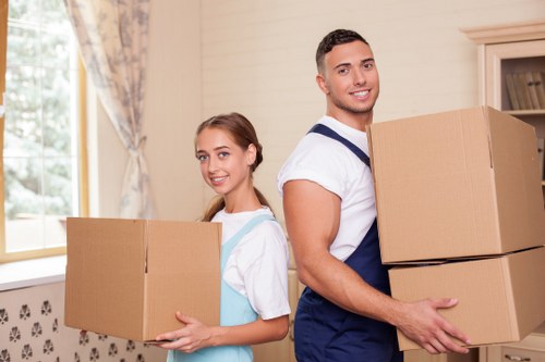 Professional moving team handling boxes and furniture