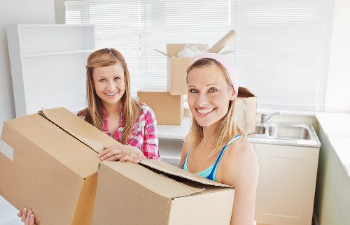 Professional removal team loading furniture for a local relocation