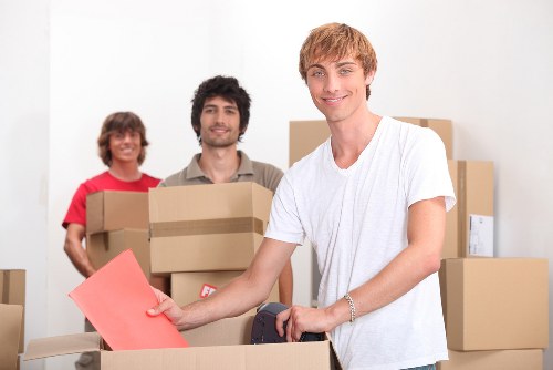 Loading furniture into a moving van for a Surrey household relocation