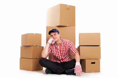 Local moving van transporting household items across Surrey